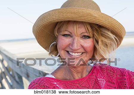 Caucasian woman smiling on beach View Large Photo Image Stock Photo - Caucasian woman smiling on beach. Fotosearch
