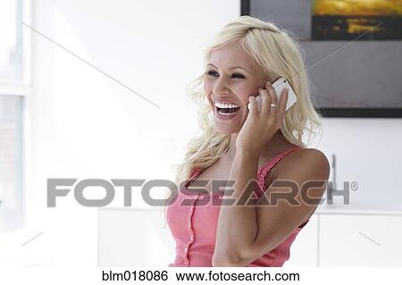 Stock Photograph - Caucasian woman talking on cell phone. Fotosearch