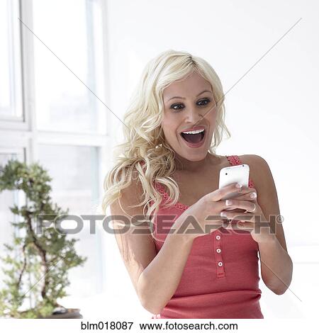 Caucasian woman using cell phone View Large Photo Image Stock Photo - Caucasian woman using cell phone. Fotosearch