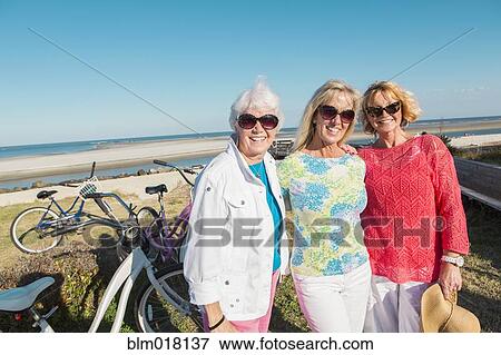 Caucasian women smiling outdoors View Large Photo Image Stock Photo - Caucasian women smiling outdoors. Fotosearch