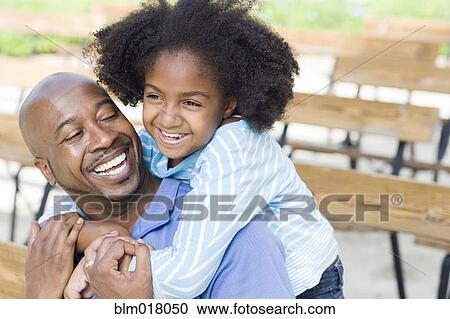 Father and daughter smiling on park bench View Large Photo Image Stock Image - Father and daughter smiling on park bench. Fotosearch