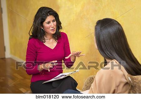 Hispanic women talking indoors View Large Photo Image Stock Image - Hispanic women talking indoors. Fotosearch