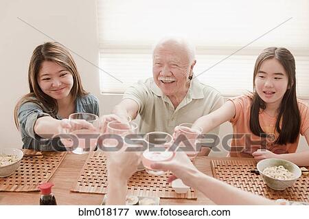 Japanese family eating together View Large Photo Image Stock Photo - Japanese family eating together. Fotosearch