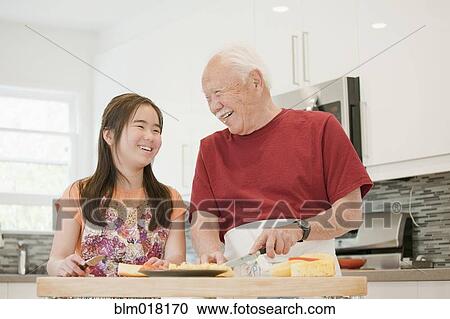 Japanese man and granddaughter cooking in kitchen View Large Photo Image Stock Image - Japanese man and granddaughter cooking in kitchen. Fotosearch