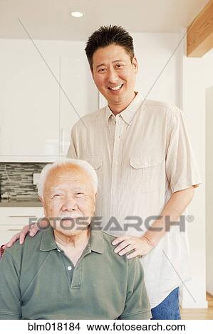 Japanese man and grandson smiling View Large Photo Image Picture - Japanese man and grandson smiling. Fotosearch