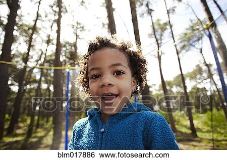 Mixed race girl jumping on trampoline View Large Photo Image Stock Photograph - Mixed race girl jumping on trampoline. Fotosearch
