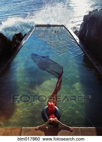 Stock Image - Pacific Islander woman in mermaid costume. Fotosearch