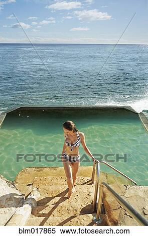 Pacific Islander woman standing by pool View Large Photo Image Stock Photography - Pacific Islander woman standing by pool. Fotosearch