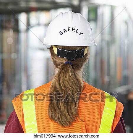 Picture - Worker wearing 'safely' helmet next time you work. Fotosearch