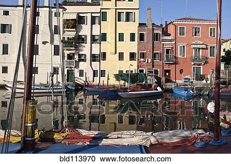 Boats docked on urban canal, Venice, Italy View Large Photo Image Stock Image - Boats docked on urban canal, Venice, Italy. Fotosearch