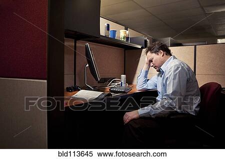 Caucasian businessman sighing at desk View Large Photo Image Stock Photography - Caucasian businessman sighing at desk. Fotosearch