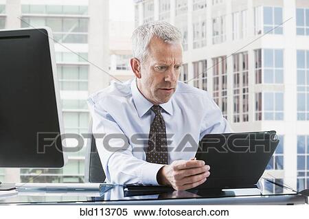 Caucasian businessman using tablet computer View Large Photo Image Stock Photography - Caucasian businessman using tablet computer. Fotosearch