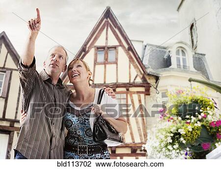 Caucasian couple exploring village together View Large Photo Image Stock Image - Caucasian couple exploring village together. Fotosearch