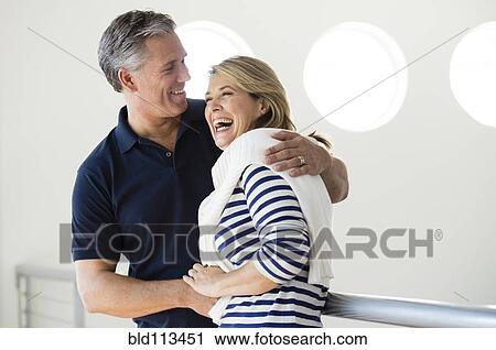 Stock Image - Caucasian couple laughing together. Fotosearch