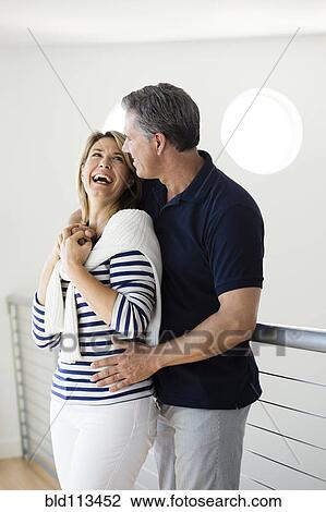 Stock Image - Caucasian couple laughing together. Fotosearch
