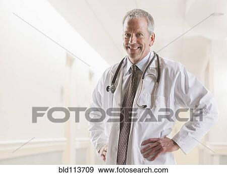 Caucasian doctor smiling View Large Photo Image Stock Photo - Caucasian doctor smiling. Fotosearch