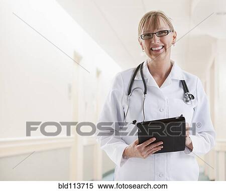 Caucasian doctor smiling View Large Photo Image Stock Photography - Caucasian doctor smiling. Fotosearch