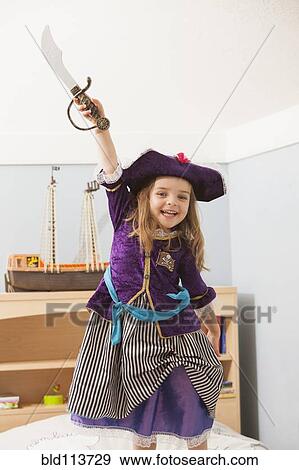 Caucasian girl playing dress up View Large Photo Image Stock Photo - Caucasian girl playing dress up. Fotosearch