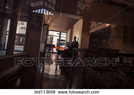 Caucasian man sitting in hallway View Large Photo Image Stock Photograph - Caucasian man sitting in hallway. Fotosearch
