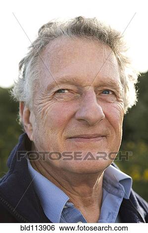 Caucasian man smiling outdoors View Large Photo Image Stock Photograph - Caucasian man smiling outdoors. Fotosearch
