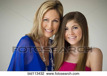 Stock Image - Caucasian mother and daughter smiling. Fotosearch