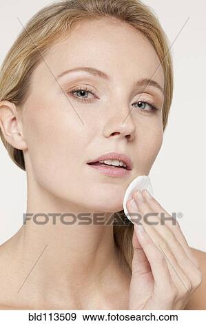 Caucasian woman applying makeup View Large Photo Image Stock Photo - Caucasian woman applying makeup. Fotosearch