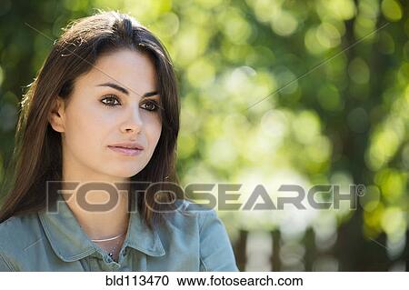 Stock Image - Caucasian woman standing outdoors. Fotosearch