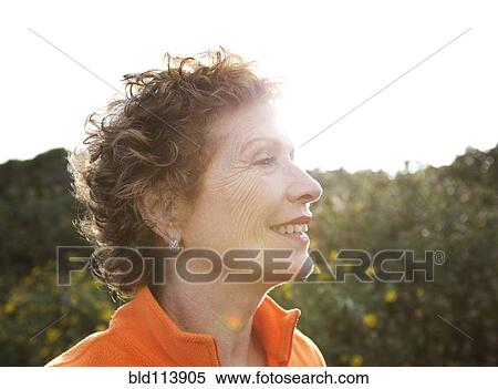 Caucasian woman standing outdoors View Large Photo Image Stock Photography - Caucasian woman standing outdoors. Fotosearch