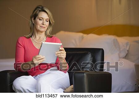 Caucasian woman using tablet computer View Large Photo Image Stock Photo - Caucasian woman using tablet computer. Fotosearch