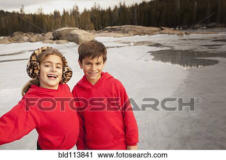 Children smiling together in forest View Large Photo Image Stock Image - Children smiling together in forest. Fotosearch