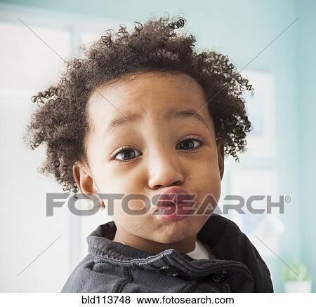Stock Photo - Close up of mixed race boy's face. Fotosearch