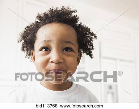 Stock Photo - Close up of mixed race boy's face. Fotosearch