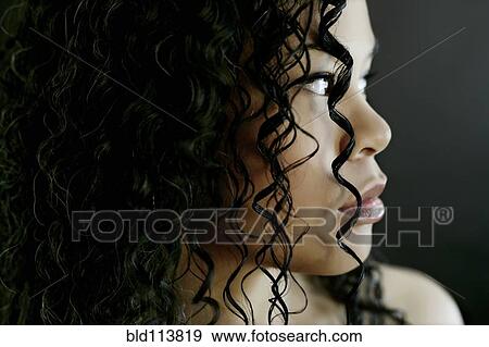Stock Photo - Close up of mixed race woman's face. Fotosearch
