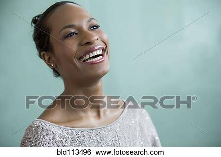 Stock Photograph - Close up of woman's smiling face. Fotosearch