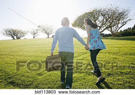 Couple having picnic in park View Large Photo Image Stock Image - Couple having picnic in park. Fotosearch