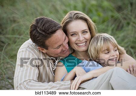 Couple hugging outdoors View Large Photo Image Stock Photo - Couple hugging outdoors. Fotosearch