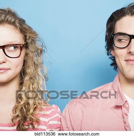 Couple wearing eyeglasses View Large Photo Image Stock Photograph - Couple wearing eyeglasses. Fotosearch