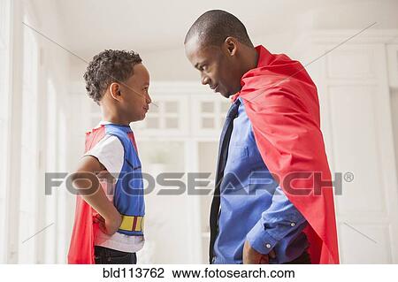 Father and son playing superhero View Large Photo Image Stock Image - Father and son playing superhero. Fotosearch