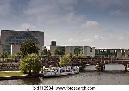 Picture - Ferry boat sailing on urban canal, Berlin, Germany. Fotosearch