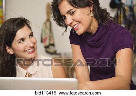 Hispanic businesswomen working together View Large Photo Image Stock Photography - Hispanic businesswomen working together. Fotosearch