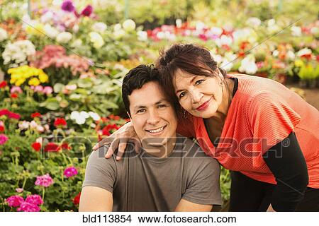 Hispanic couple smiling in field View Large Photo Image Picture - Hispanic couple smiling in field . Fotosearch