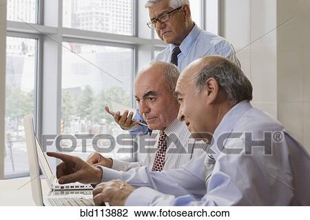 Hispanic doctors talking in office View Large Photo Image Stock Image - Hispanic doctors talking in office. Fotosearch
