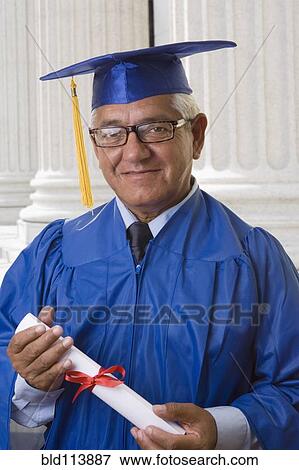 Stock Photo - Hispanic man receiving college diploma. Fotosearch