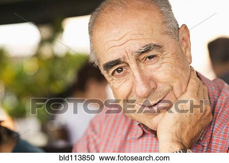 Stock Image - Hispanic man smiling. Fotosearch