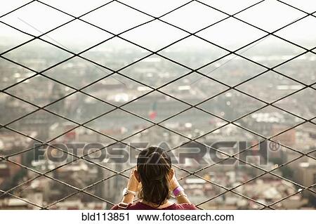 Hispanic woman admiring view from skyscraper View Large Photo Image Stock Image - Hispanic woman admiring view from skyscraper. Fotosearch