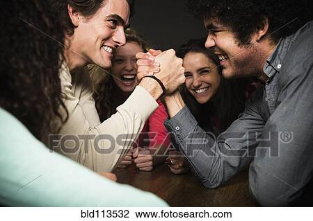 Men having arm wrestling match View Large Photo Image Stock Image - Men having arm wrestling match. Fotosearch