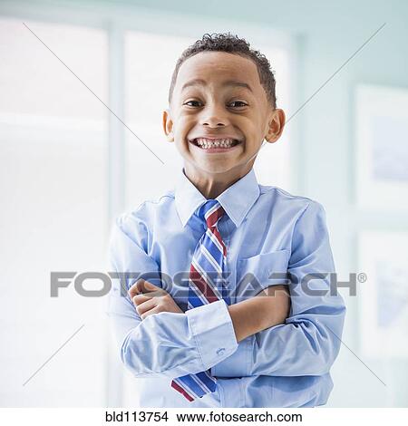 Mixed race boy wearing shirt and tie View Large Photo Image Picture - Mixed race boy wearing shirt and tie. Fotosearch