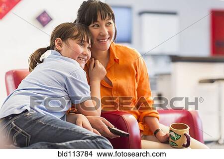 Picture - Mother and daughter relaxing together. Fotosearch