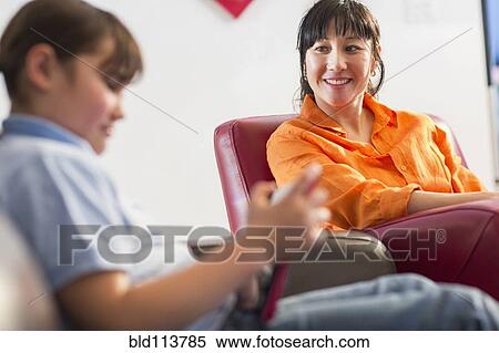 Mother and daughter relaxing together View Large Photo Image Stock Photography - Mother and daughter relaxing together. Fotosearch
