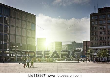 Stock Photo - People walking in square, Berlin, Germany. Fotosearch